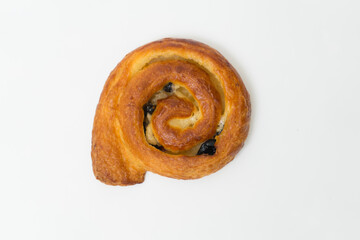 Sweet cinnamon bun roll swirl isolated over the white background