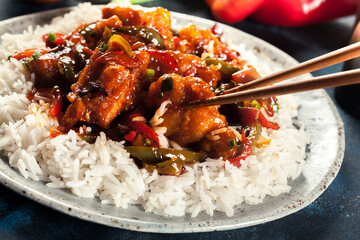 Sweet and sour chicken with colorful bell pepper with rice