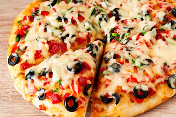 Pizza with salami and olives. Italian food background. Happiness is in small things. Creative copy space.