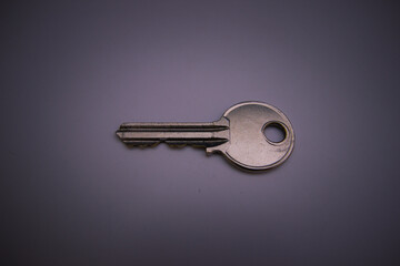 key on dark gray background