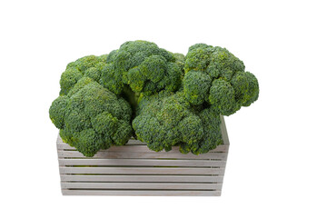 Fresh tasty broccoli in wooden box isolated