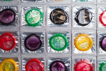Colorful condoms background.