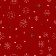 Seamless pattern - different snowflakes on a red background.