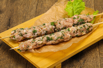 Raw minced pork skewer kebab for grill