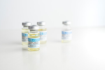closeup coronavirus vaccine, defocused white background