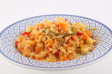 rice with paprika carrots and vegetables as vegan food