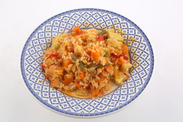 rice with paprika carrots and vegetables as vegan food