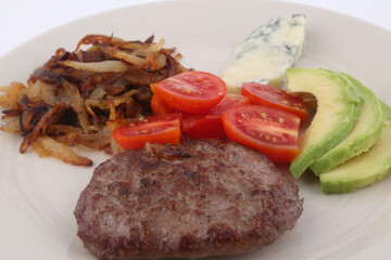burger with gorgonzola, onion tomato cherry and avocado