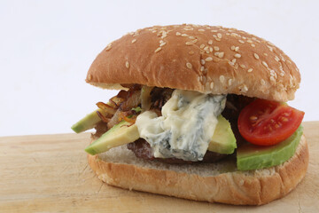 burger with gorgonzola, onion tomato cherry and avocado