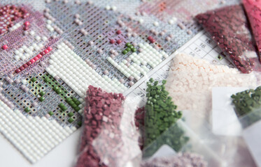 Handmade process of creation of diamond painting 3d from square rhinestones