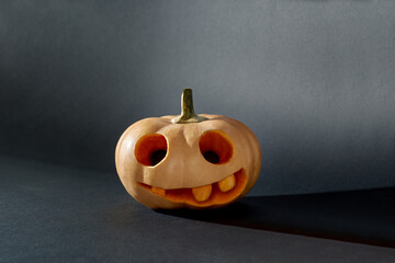Halloween pumpkin lantern on black paper background