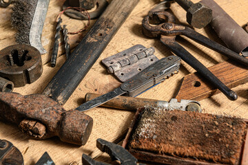 Old vintage household hand tools still life on a wooden background in a DIY and repair concept