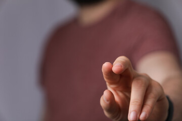 A man hand touching virtual screen, modern background concept , can put your text at the finger,...