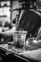 Hand of professional tattooist with a tattoo machine.