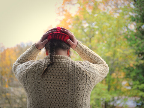 A Bearded Man In Red Beanie  Wearing A Woollen Sweater