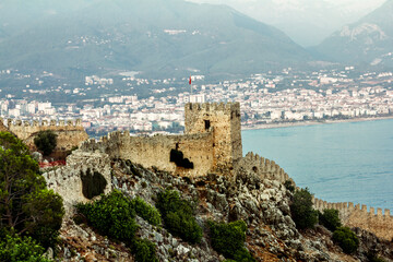 Fototapeta na wymiar View of the walls of the ancient fortress and the harbor in Alanya in Turkey