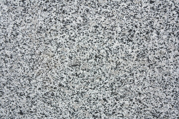 Textured abstract background in gray granite color.