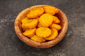Marinated yellow patisson in the bowl