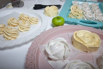 Fototapeta na wymiar Freshly cooked zephyr on a tray. Marshmallow made at home. Cooking sweets during a pandemic.