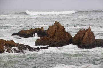 The Knysna Heads, sandstone cliffs that separate the Knysna Lagoon from the pacific ocean. A famous landmark along the renowned Garden Route, South Africa, Africa.