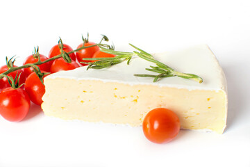 Fototapeta na wymiar Brie cheese with cherry tomatoes and rosemary isolated