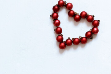 red heart made of Christmas balls on a white background, Merry Christmas