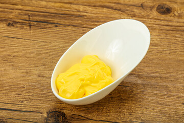 Natural cheese sauce in the bowl