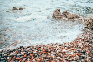 Small pebbles on the sea beach - peace and tranquility - restoration of the nervous system