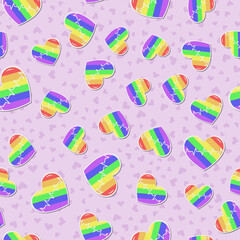 Seamless vector pattern with rainbow LGBT hearts with pulse line on pink background. Pride flag color illustration