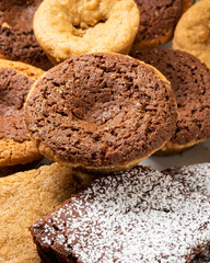 Cookie-brownies on a plate. Delicious cookies filled with brownie. Placed on different backgrounds and shot at different angles to show different characteristics. Perfect for bakeries or restaurants