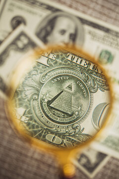 Unfinished pyramid on one dollar bill with inscriptions - thirteen first states of the united states - macro photography
