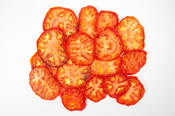 slices of dried tomato on a white background. vitamin vegetable food
