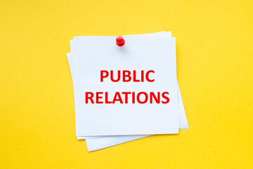 Text public relations on white sticker with yellow background