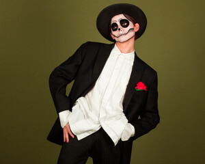 Photo of scary dangerous enigmatic man charismatic charming dance hold cap wear white shirt rose...