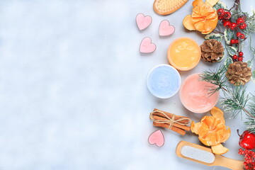 Christmas spa and wellness composition with creams, fir branches, cinnamon, aromatherapy and winter skincare, lifestyle concept, invitation and advertising salon, flat lay, selective focus