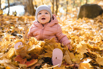 happy playful child girl outdoors in autumn season