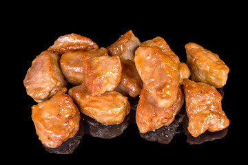 Tasty pork bites, isolated on black background