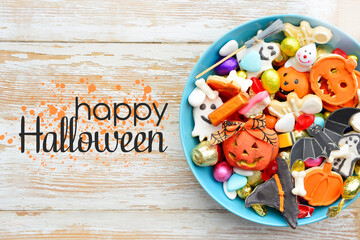 candy bowl of chocolates and sweets, Halloween Jack o Lantern cookies - Trick or Treat Halloween card background