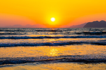 Obraz premium Sunset on the sea, Iztuzu beach in Dalyan, Turkey