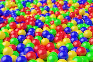 Fototapeta na wymiar Ball pool or pit filled with red, green, yellow and blue plastic balls, abstract texture background, selective focus