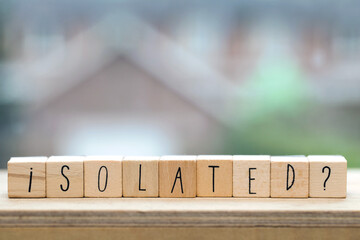 Wooden cubes with the word isolated for Coronavirus, Covid-19 and quarantaine and feeling alone background