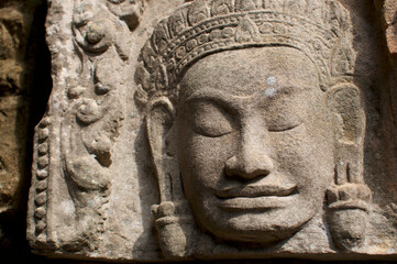 Fototapeta na wymiar Stone Buddha statue at Angkor Wat in Cambodia