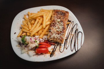 roast meat with cheese and salad on a plate and salad on a plate