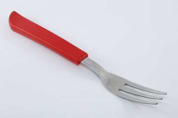Fork with red handle and white background