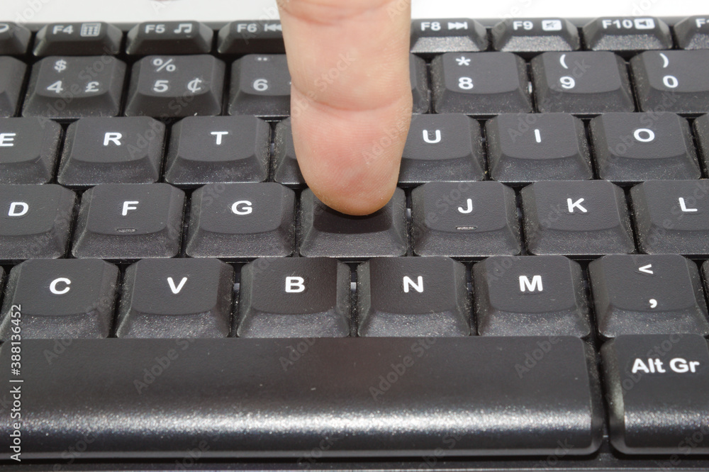 Poster finger typing on the keys of a computer keyboard