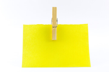 Yellow paper hanging with a clothespin