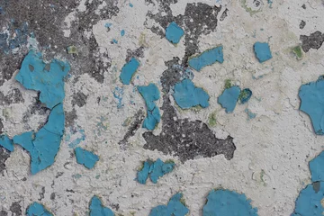 Papier Peint photo Vieux mur texturé sale Blue peeling paint on the wall. Old concrete wall with cracked flaking paint. Weathered rough painted surface with patterns of cracks and peeling. High resolution texture for background and design.