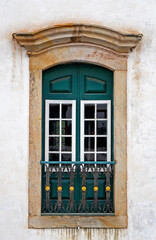 Fototapeta na wymiar Ancient colonial window in historical city of Ouro Preto, Brazil