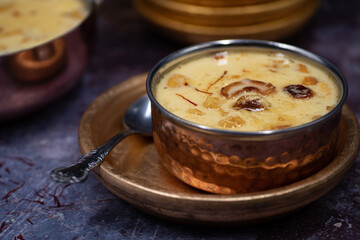 Indian rice pudding kheer pal payasam in traditional serving dish