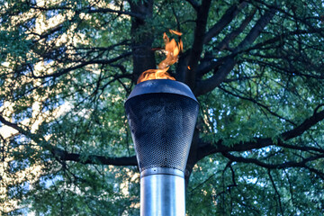 Eternal flame flickering at a memorial park 